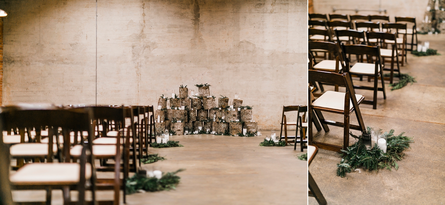 woodland aisle decor with candles and dark wood chairs