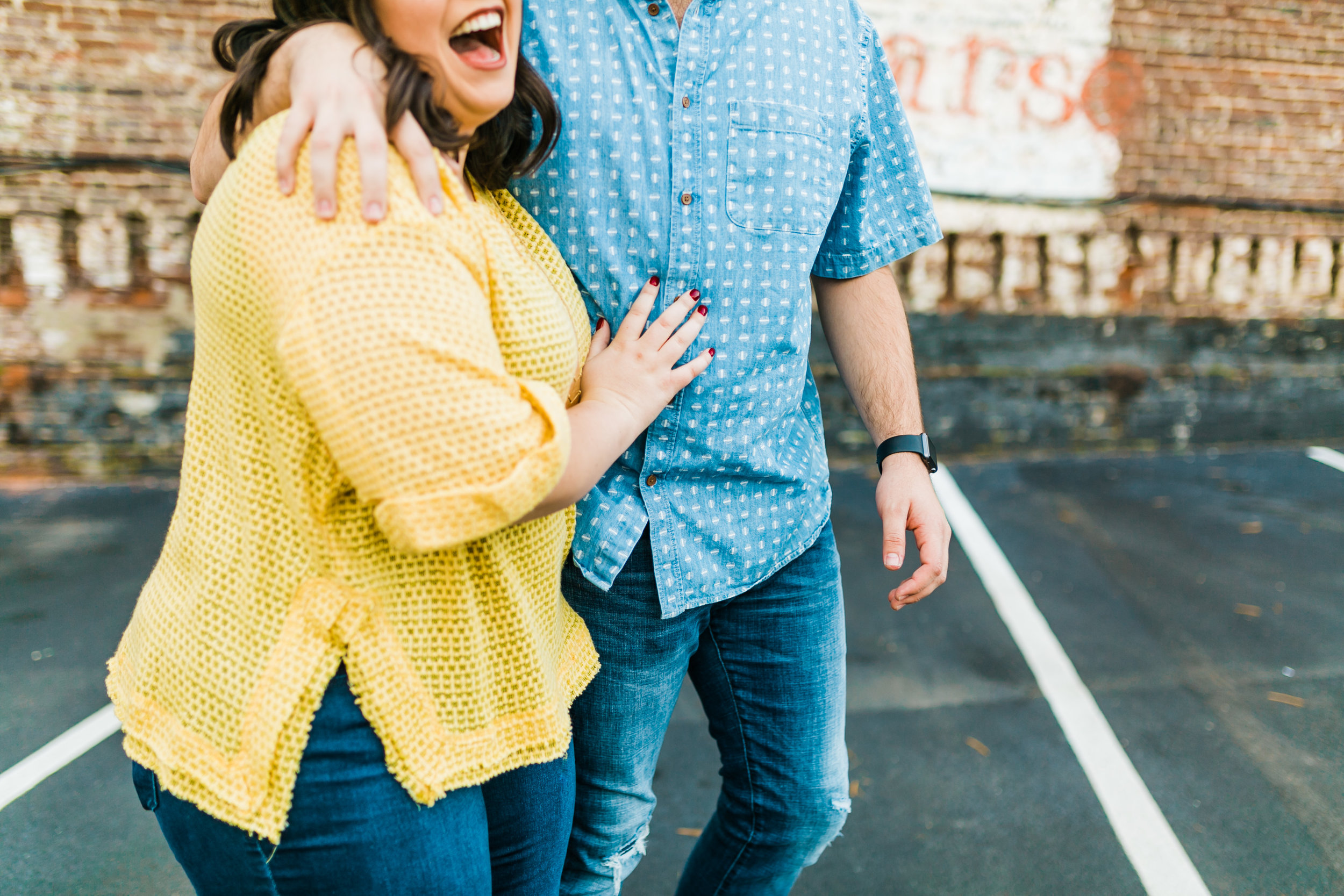 couple laughing engagement photos
