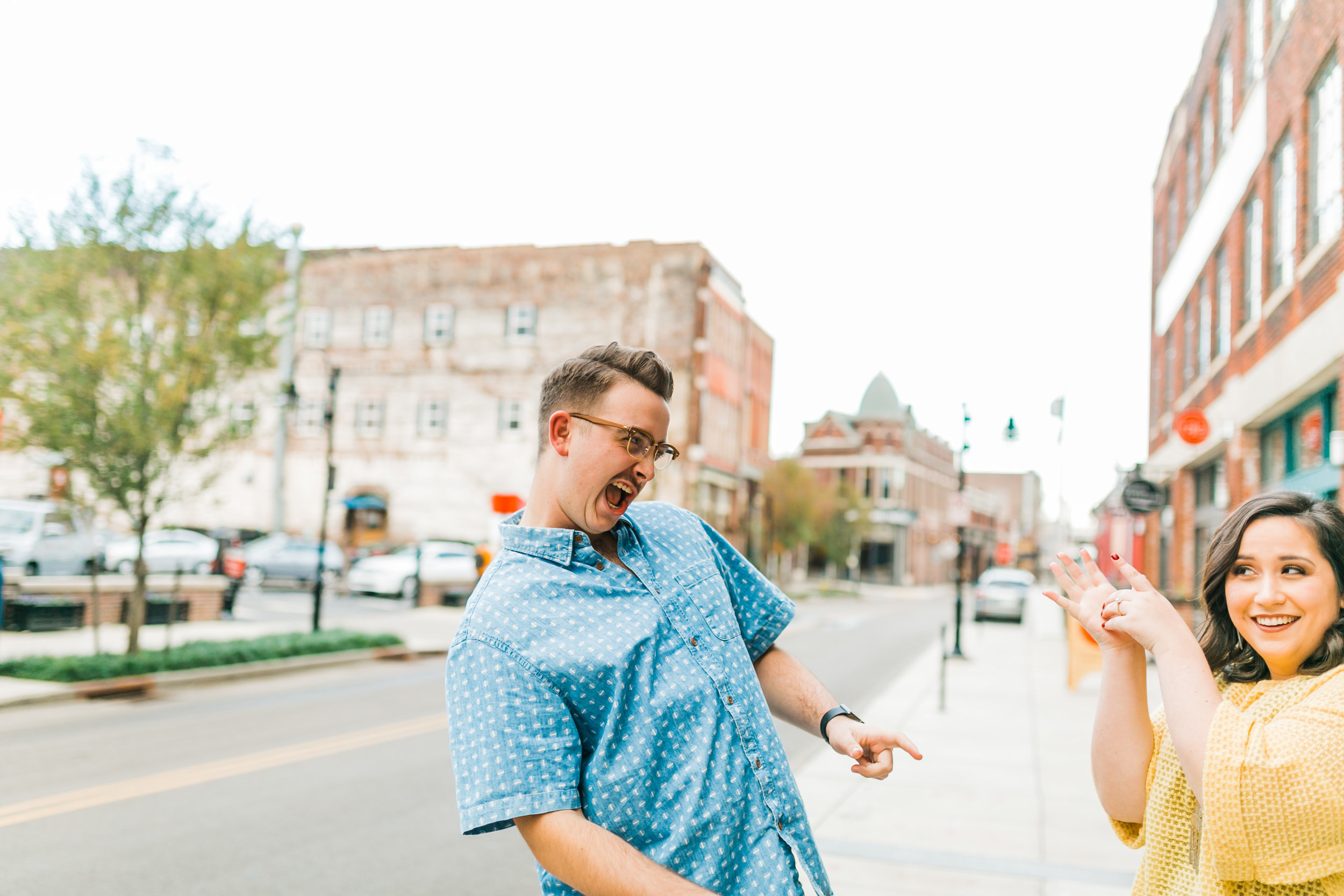 couple playing in downtown knoxville engagement photos