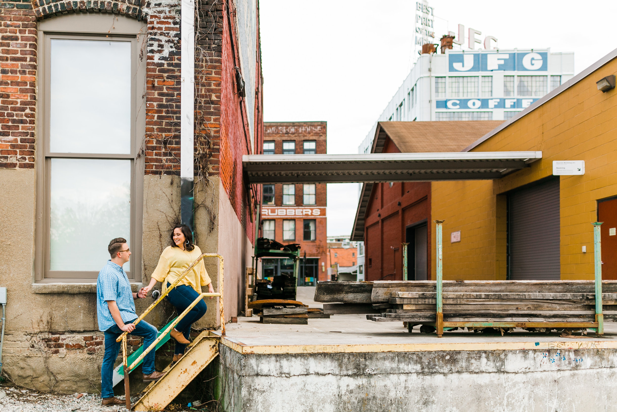 casual engagement session outfits beside traintracks and jfg building in the old city knoxville