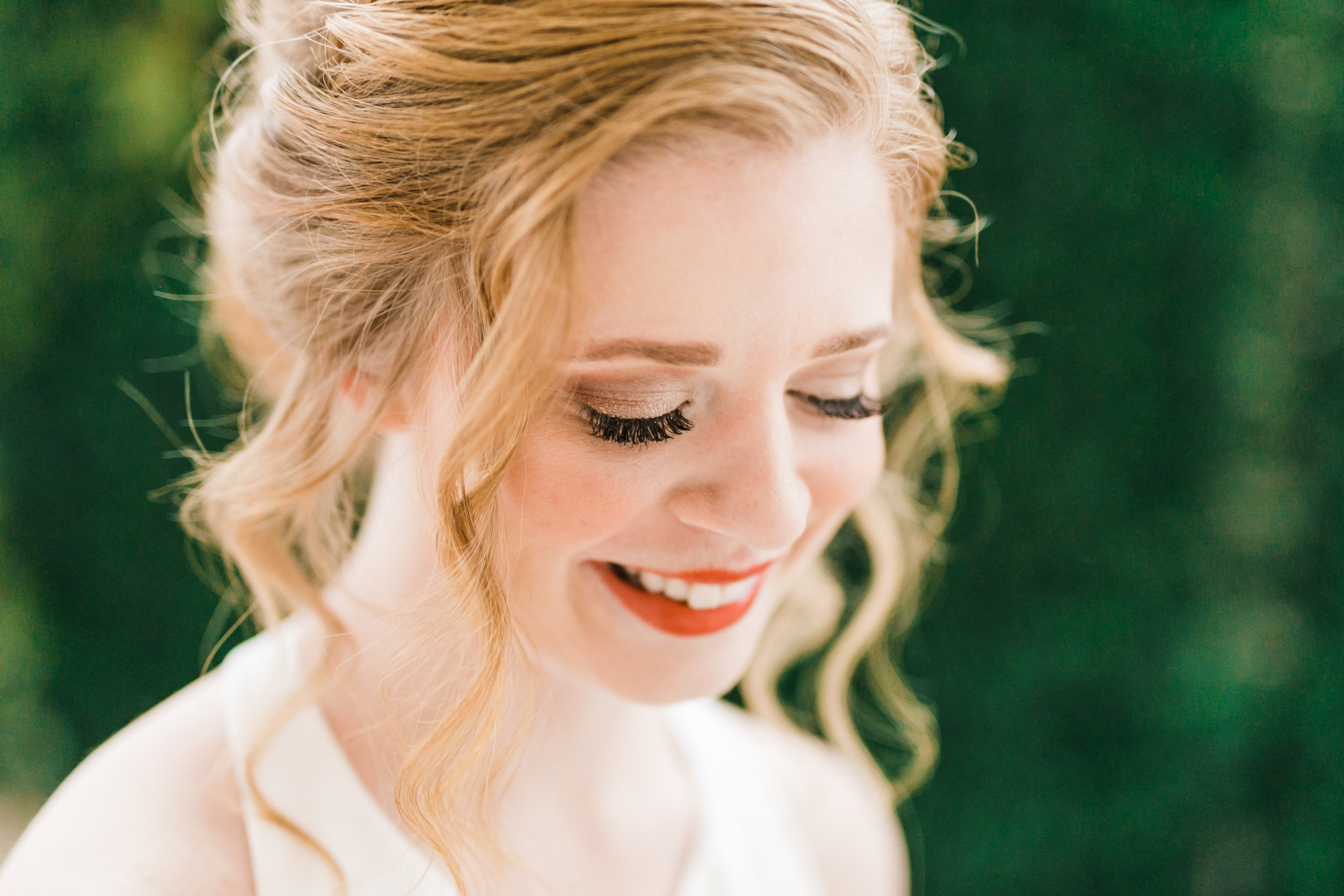 classic glam makeup on fair complexion bride with red hair