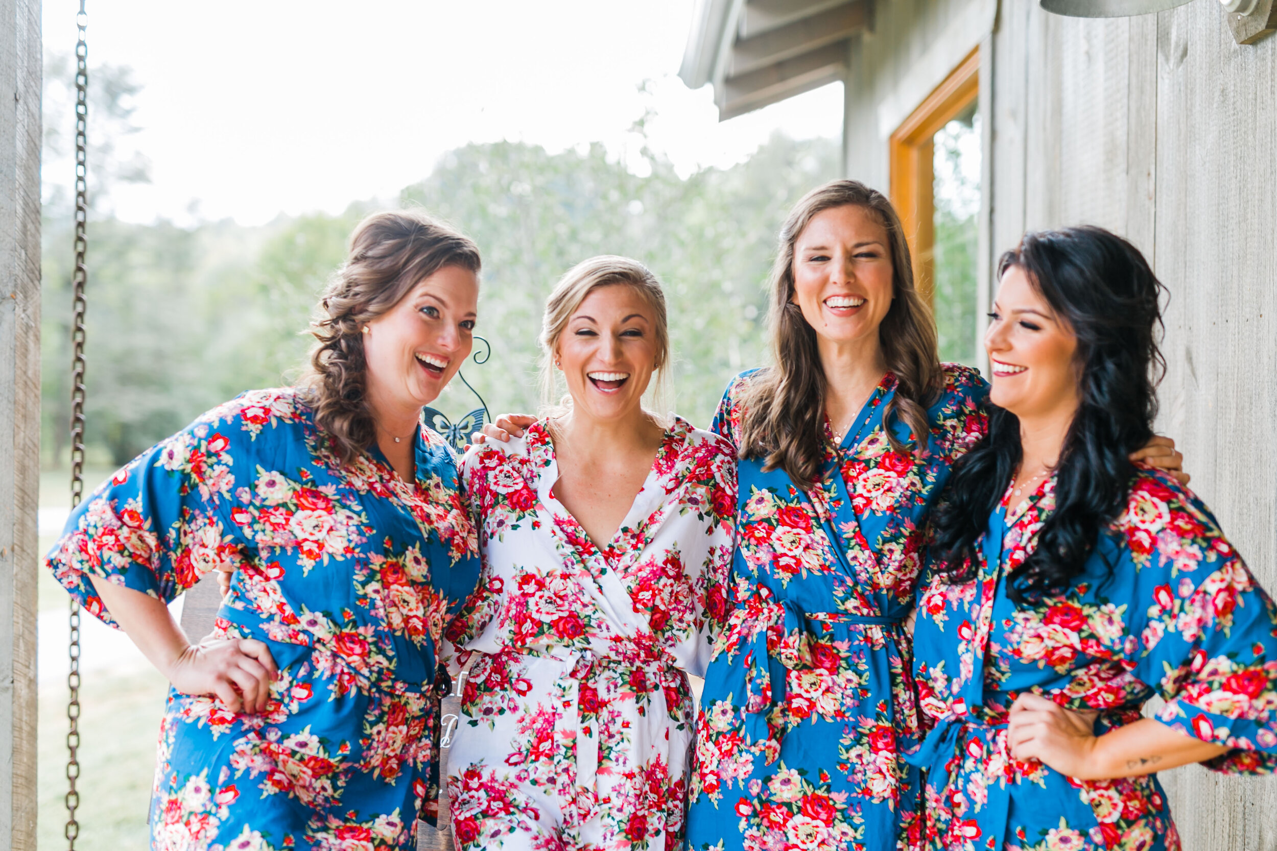 bridesmaids with bride in robes 