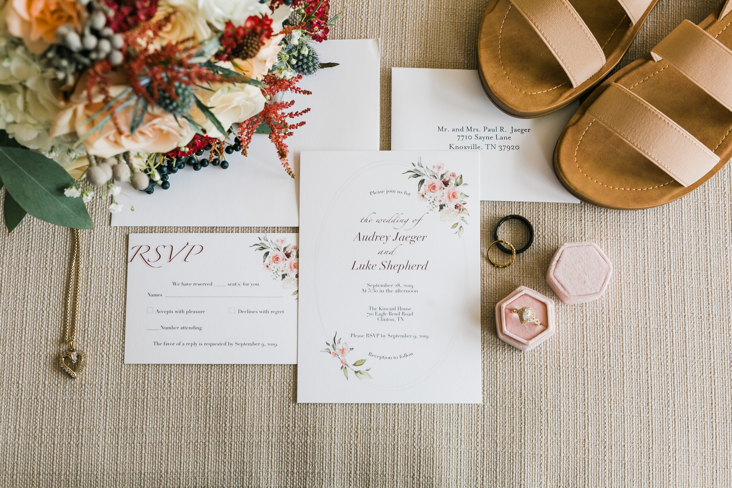 invitation suite flat lay pink and red fall