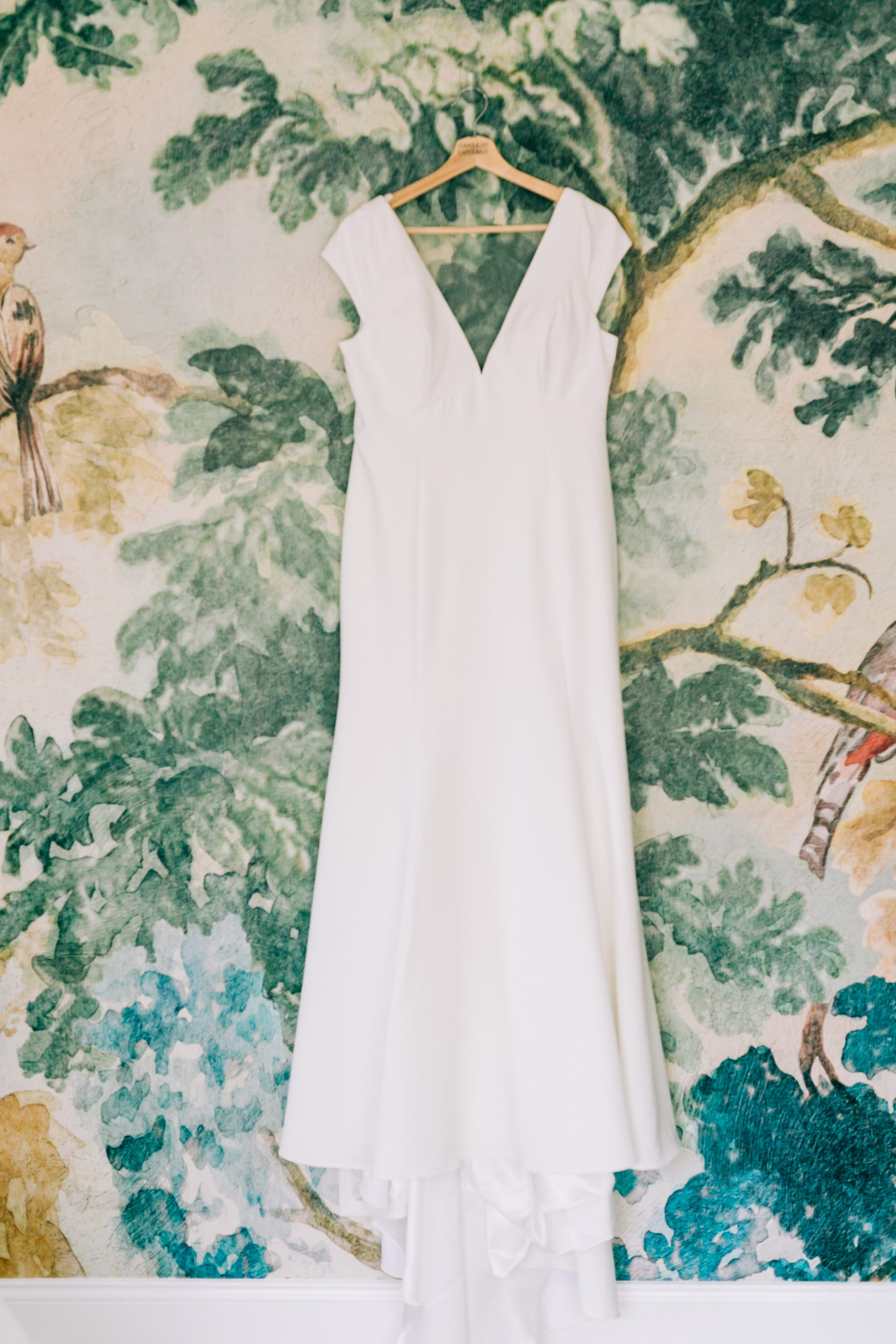 modern wedding dress hanging at oak leaf cottage Chattanooga wallpaper