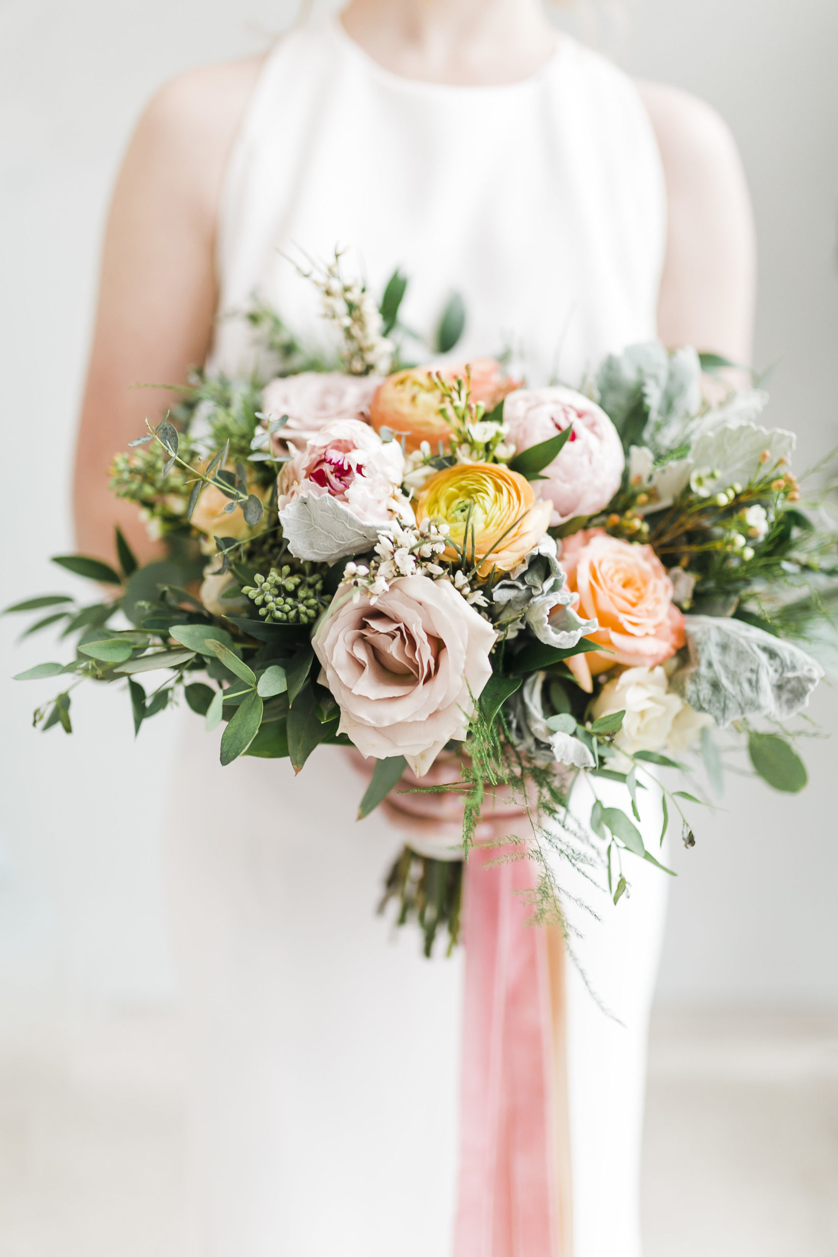 ranunculus and peony bouquet with pink and coral ribbons lb floral