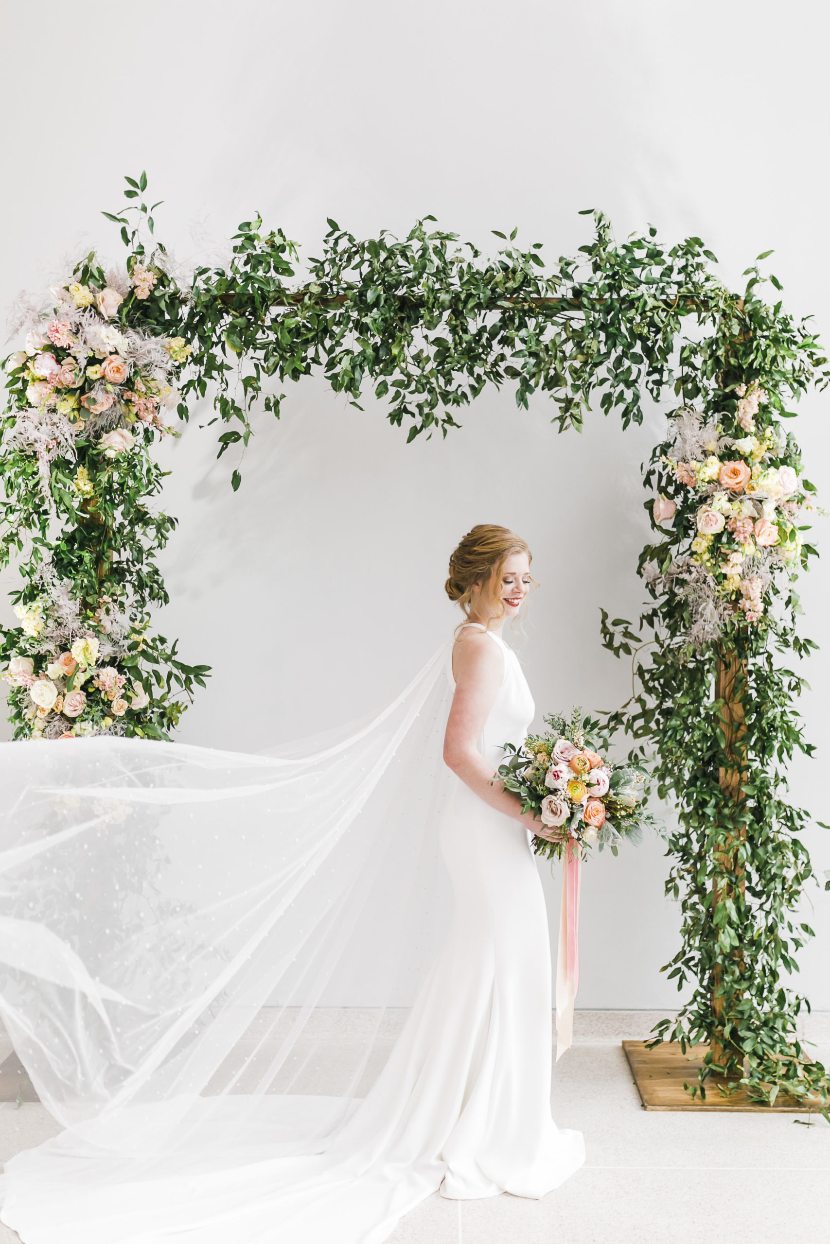 floral arch with bride in classic dress at knoxville museum of art with lb floral